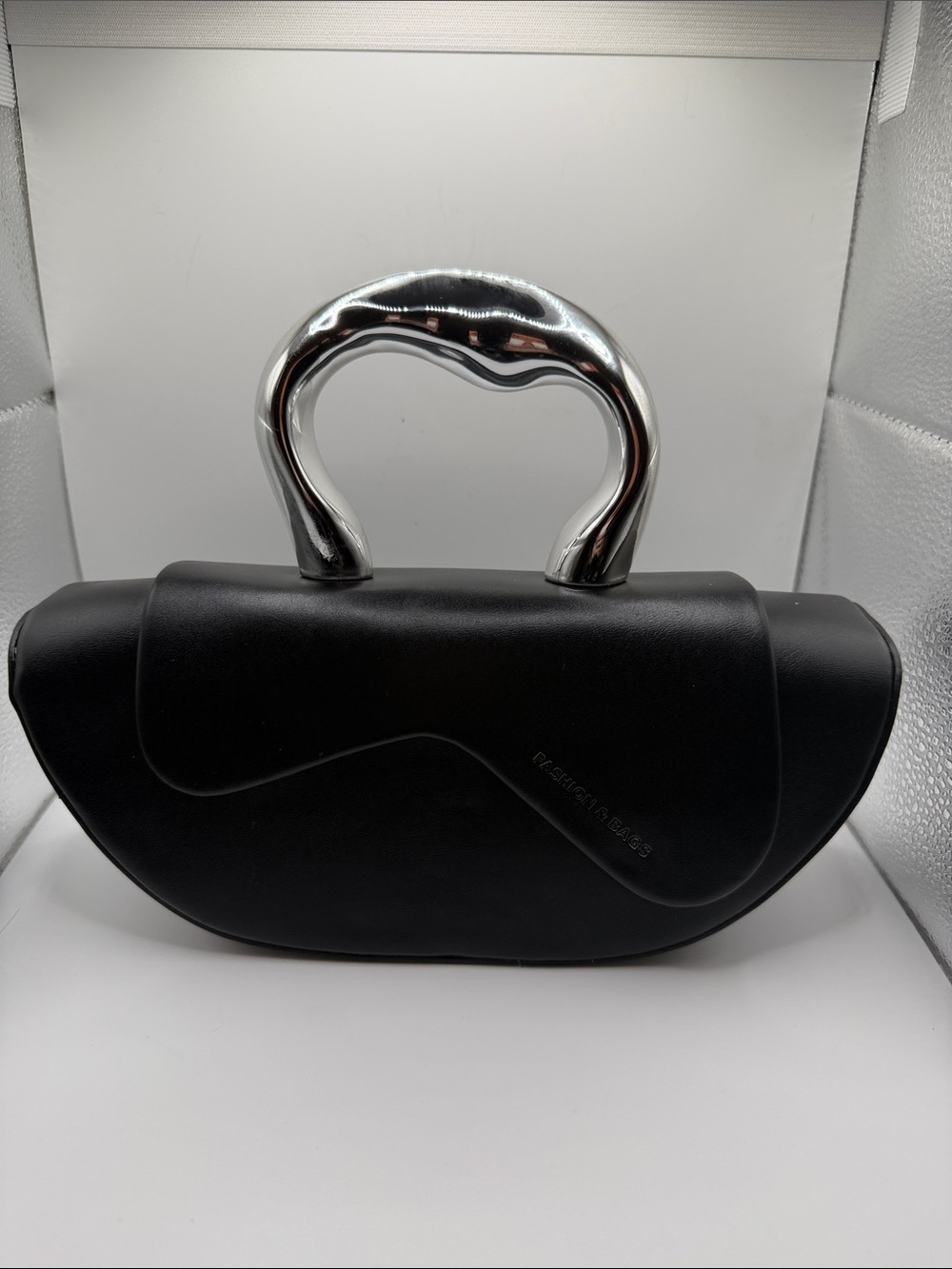 Black Sculpted Top-Handle Bag with Silver Hardware